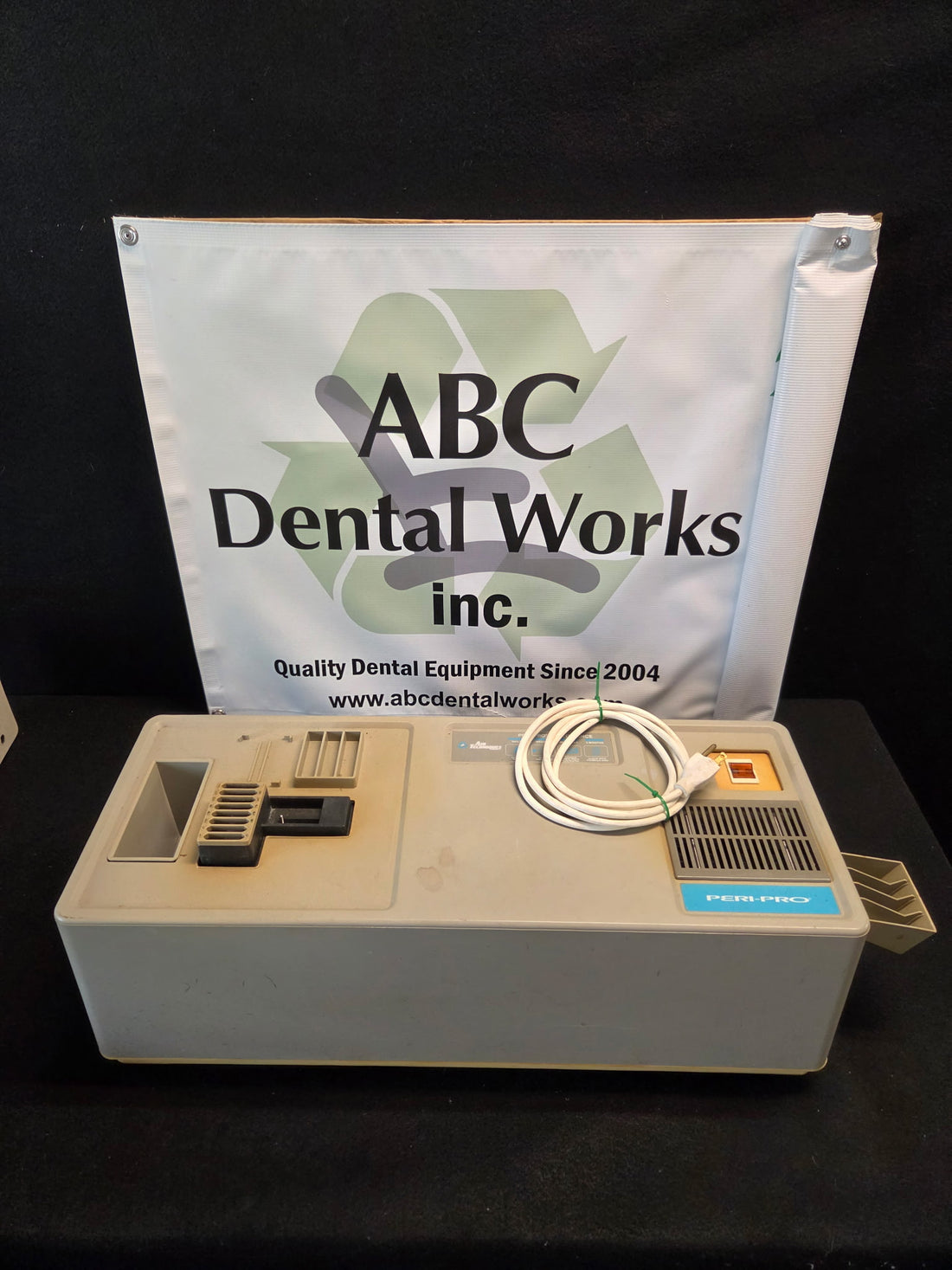 Refurbished Air Techniques Peri-Pro dental X-ray film processor, closed benchtop unit with film feed slot, dryer vent and power cord