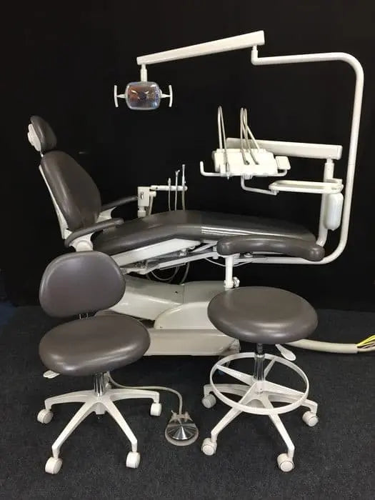 Refurbished A-dec 1021 Cascade dental chair with Euro-style delivery, 6300 operatory light and two matching stools