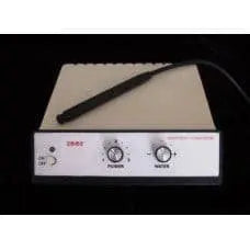 Dentsply Cavitron 2002 AutoTune ultrasonic scaler with power and water dials and scaler handpiece resting on top
