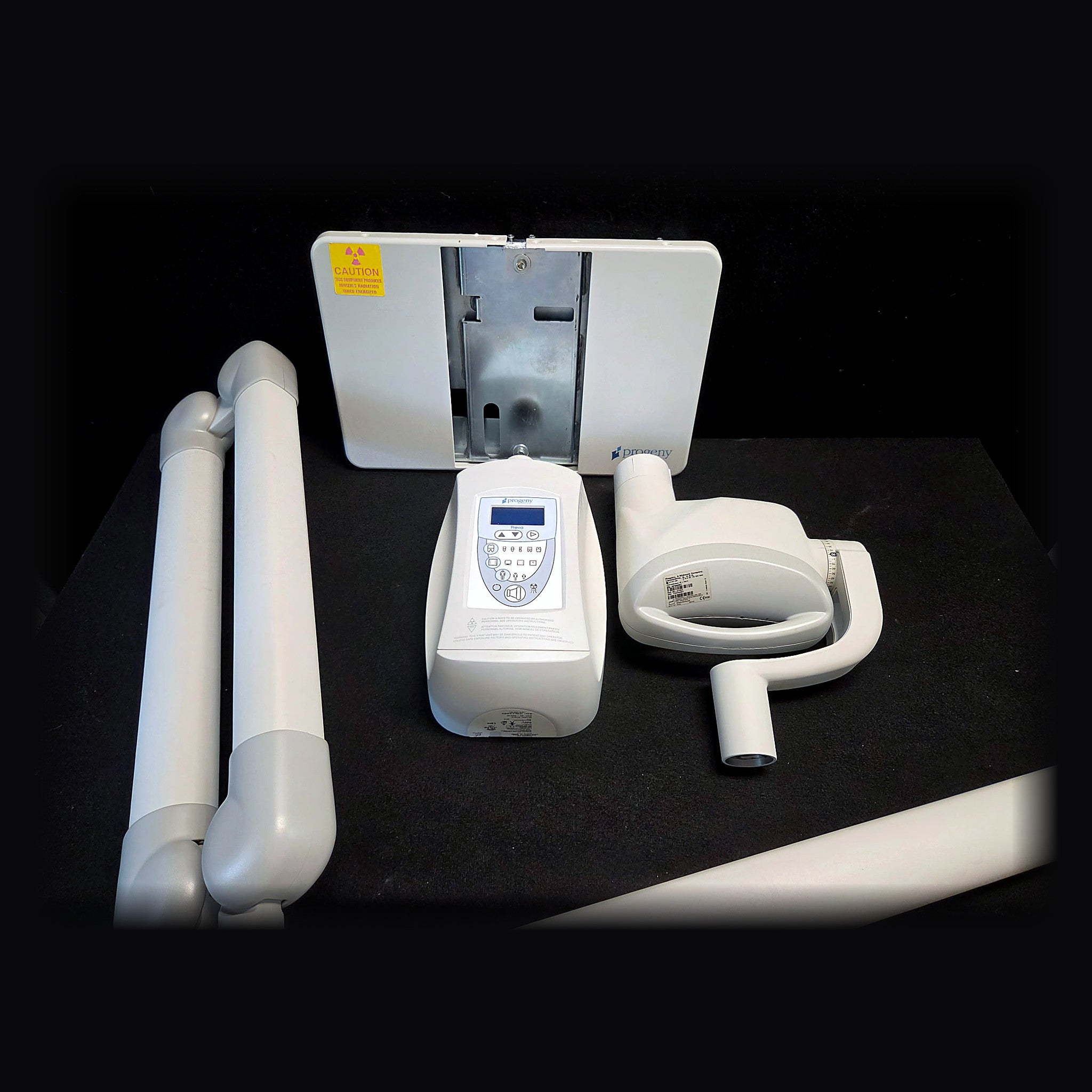 Midmark Progeny Preva intraoral X-ray: Preva LCD control panel, tube head with yoke and cone, wall mount backplate and scissor arm assembly