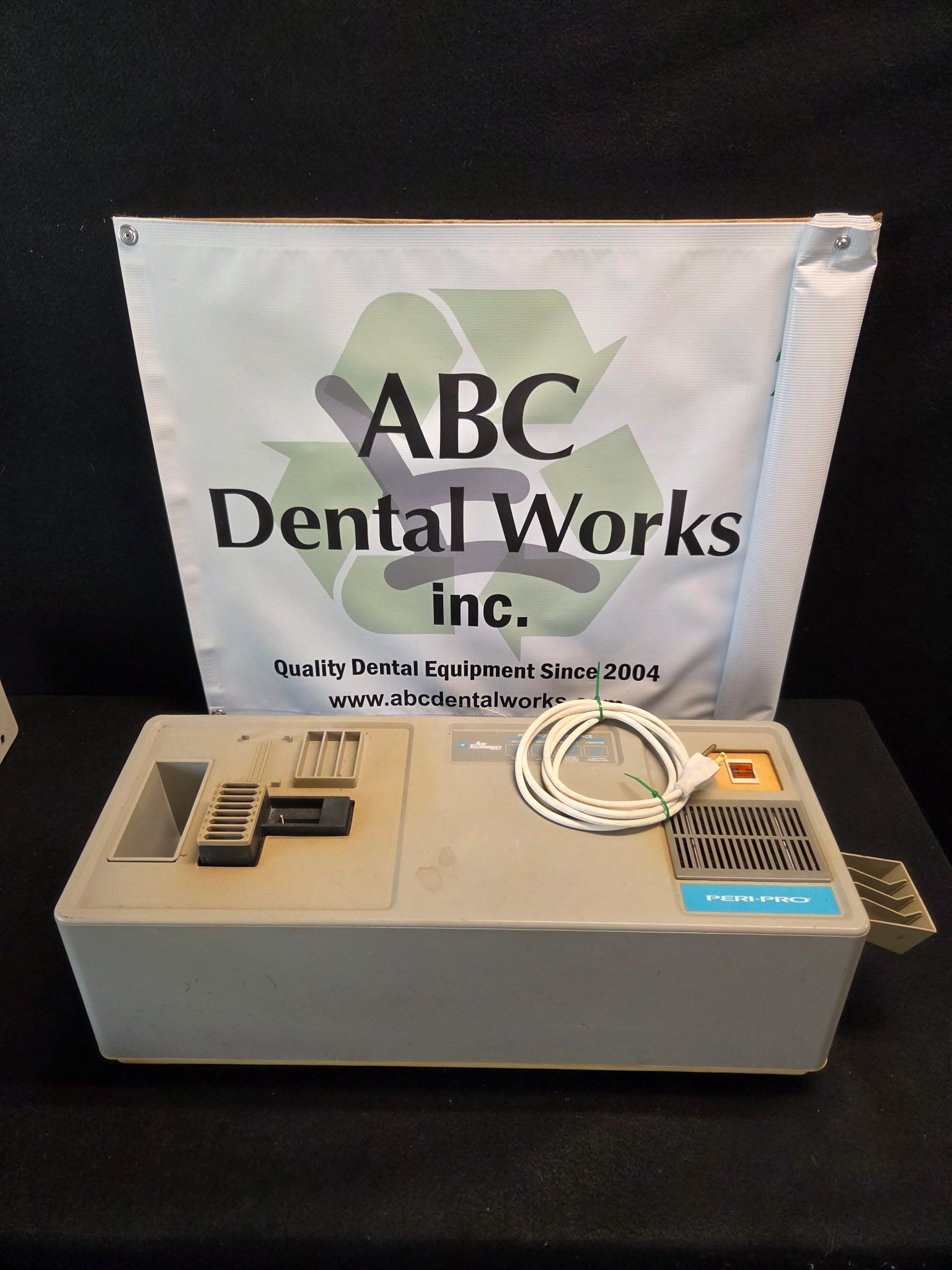 Refurbished Air Techniques Peri-Pro dental X-ray film processor, closed benchtop unit with film feed slot, dryer vent and power cord