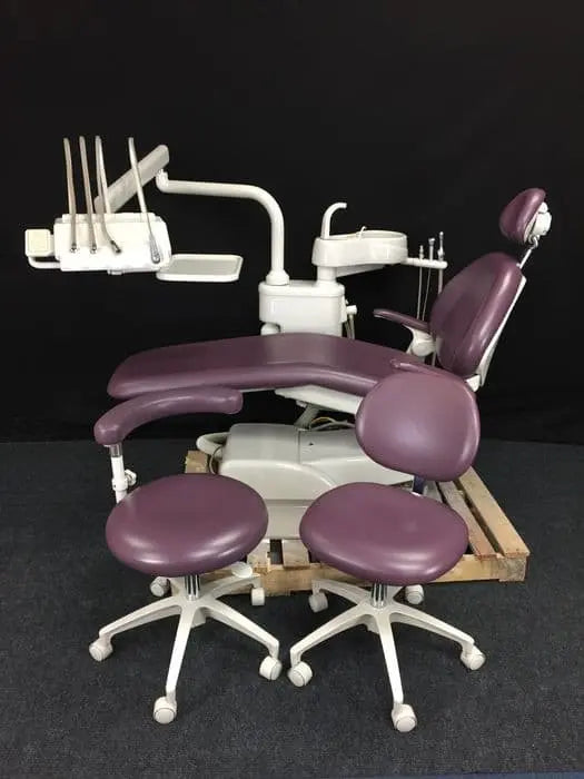 Refurbished A-dec 1021 Decade Cascade package in mauve upholstery with Euro-style delivery, cuspidor and two matching stools