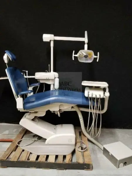 Refurbished A-dec Performer III 8000 dental chair in blue upholstery with radius delivery, cuspidor and 6300 operatory light