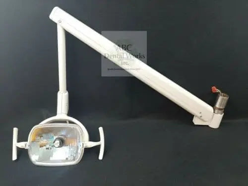 A-dec 6300 ceiling track light arm laid out on a black backdrop, full length with light head, yoke handles and track mount post