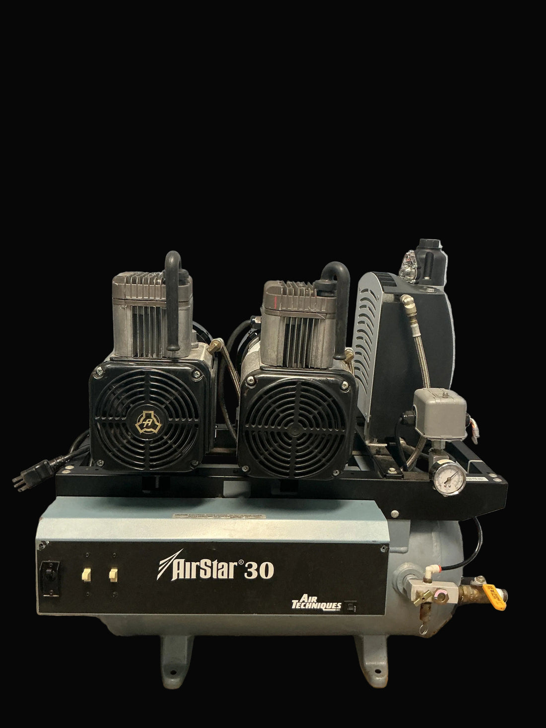 Air Techniques AirStar 30 dental compressor, straight front view: twin oil-less pump heads, badged tank shroud and desiccant dryer at right.