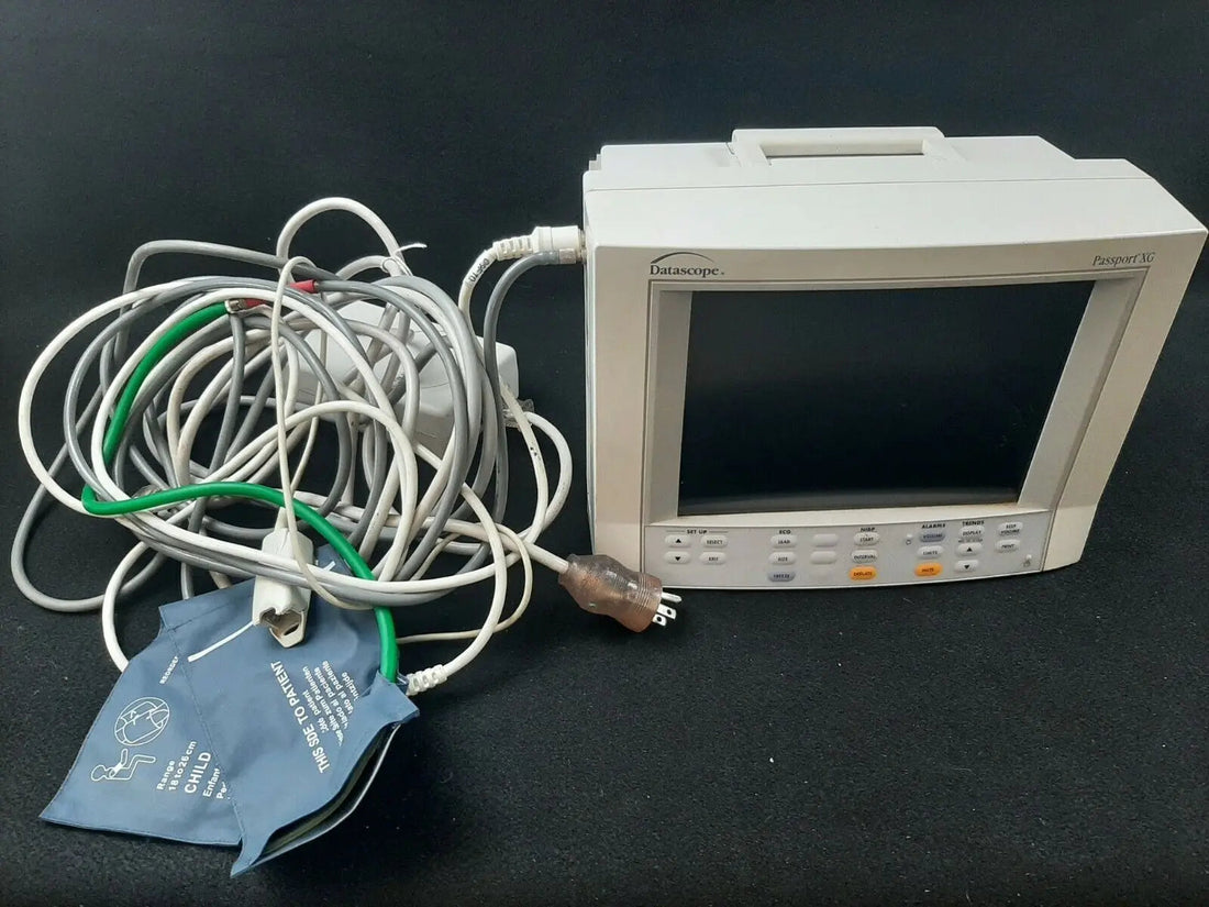 Datascope Passport XG patient monitor, front display with NIBP cuff and patient cables