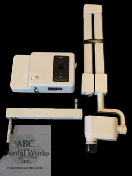 Gendex GX-770 intraoral X-ray components laid out on a black backdrop: control timer module, folded scissor arm, tubehead yoke and wall mount
