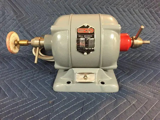 Handler Red Wing 26A dental lathe, side view on a moving blanket with buffing wheel, chuck and Red Wing motor nameplate.