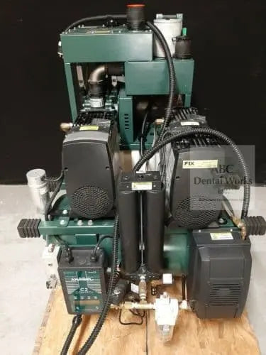 Ramvac Osprey OSP24S dental air compressor, front view on a wood pallet with green tank, dryer column and black control box.