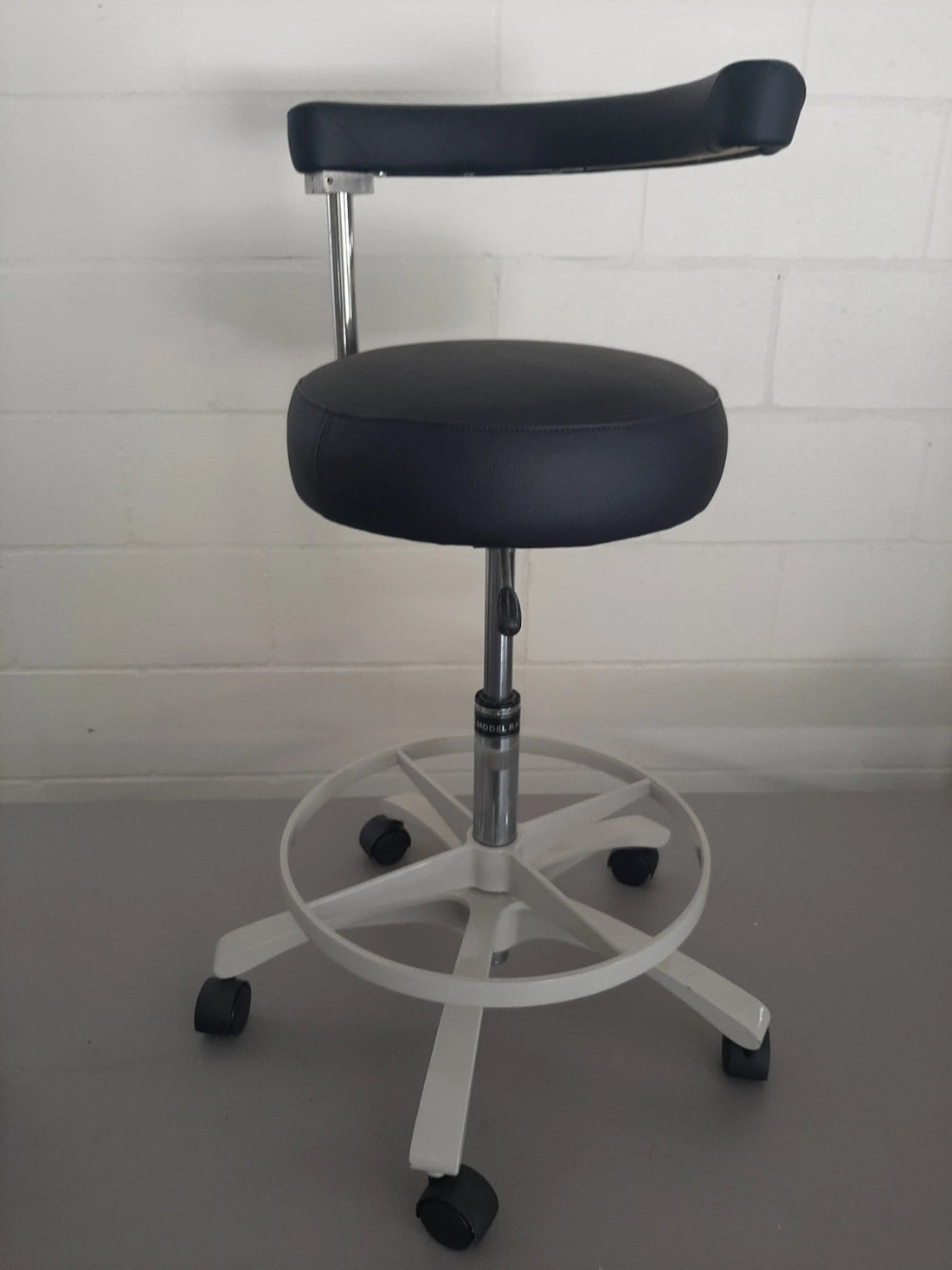 Royal RDAS-1 dental assistant stool with black upholstery, front view