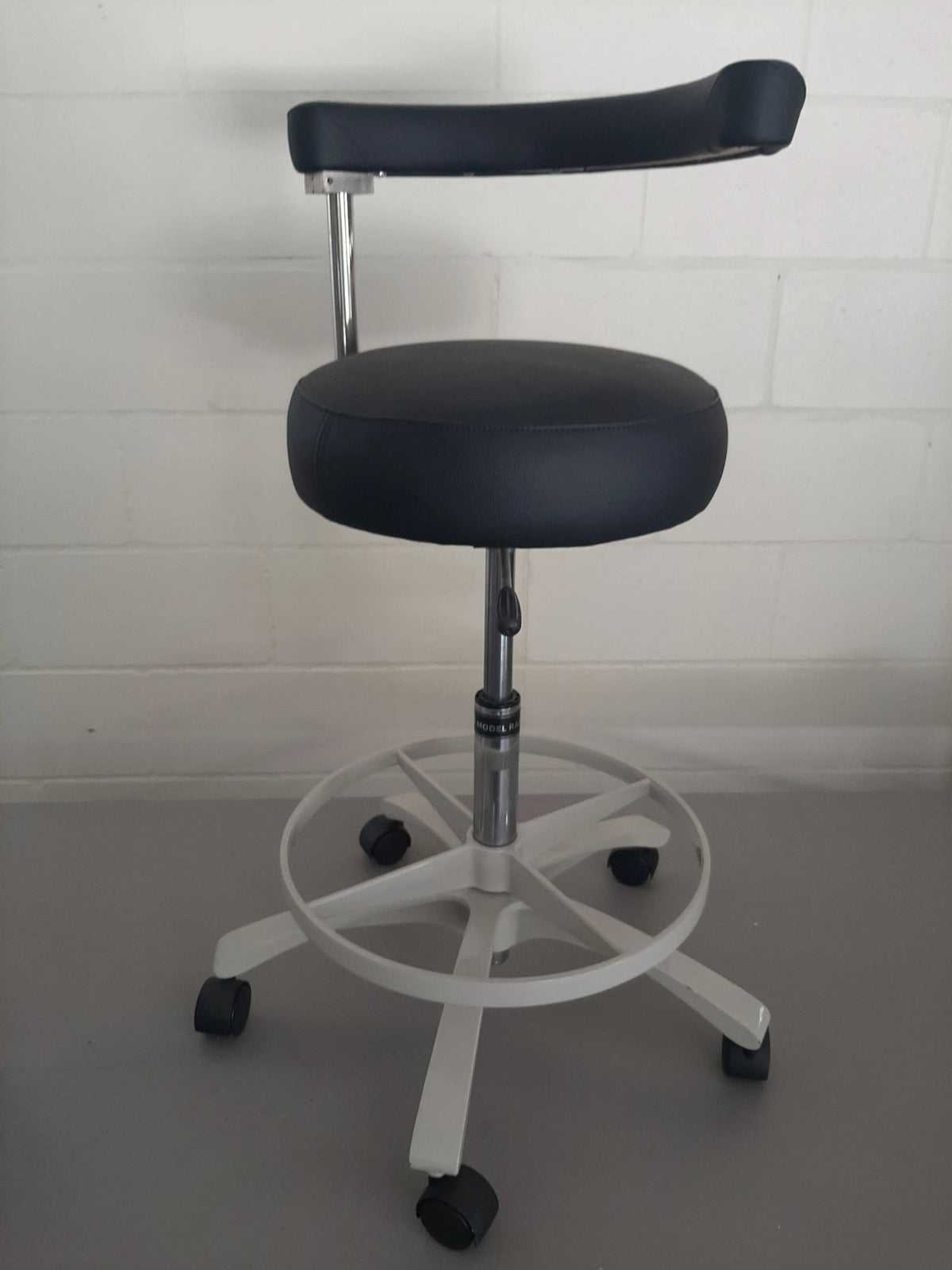 Royal RDAS-1 dental assistant stool with black upholstery, front view