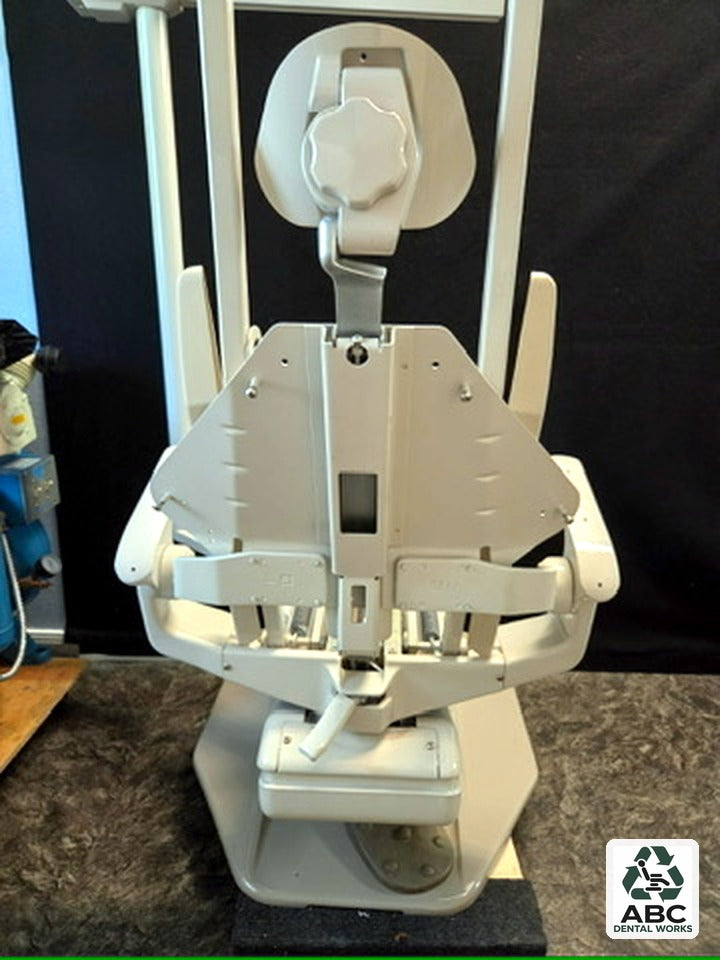 Refurbished A-dec 1021 dental chair frame from the front showing headrest, backrest and seat frames without upholstery