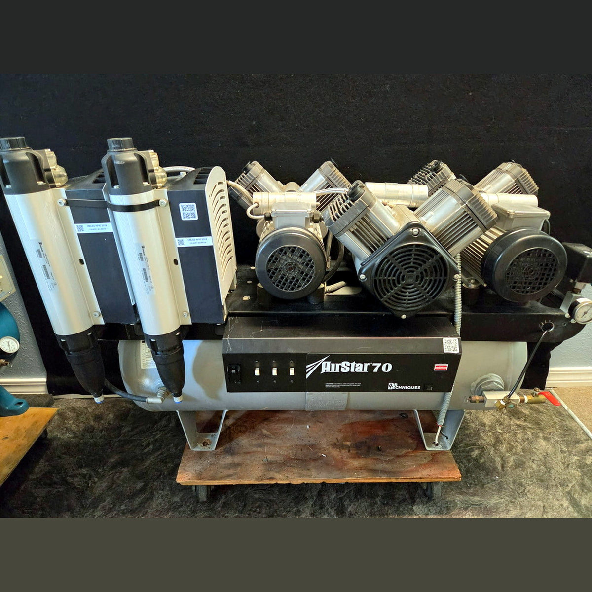 Refurbished Air Techniques AirStar 70 AS70 oil-free dental air compressor, full unit front-left view showing triple compressor head bank, twin membrane dryer columns and 30-gallon receiver tank