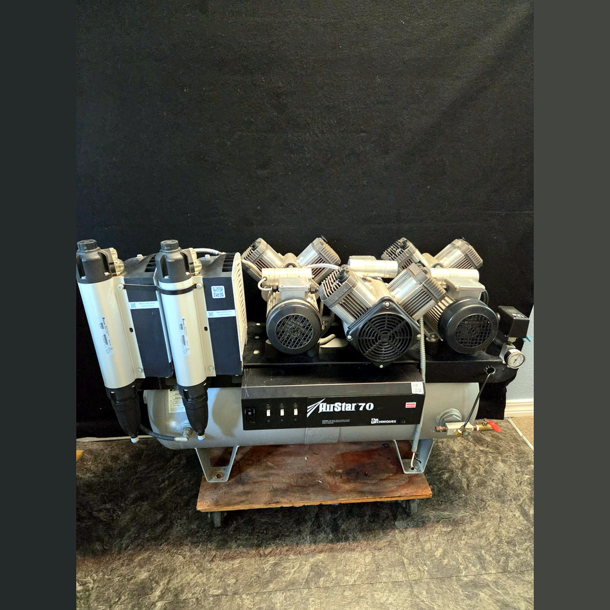 Air Techniques AirStar 70 AS70 dental air compressor, straight-on front view showing AirStar 70 control panel, per-head switches, regulator and outlet gauge