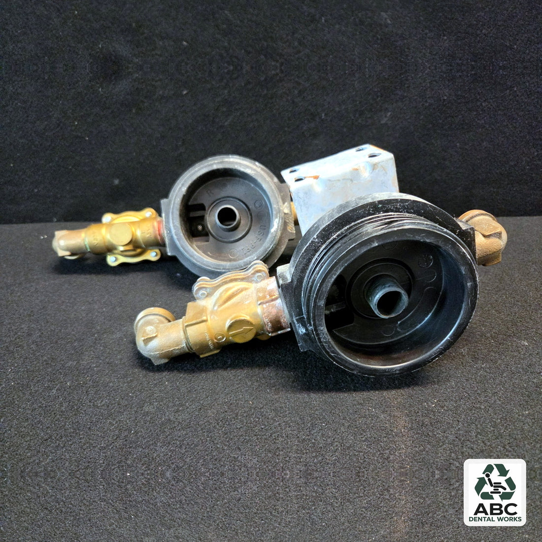 Air Techniques 3/4 inch water filter housing head with brass solenoid valve body and plumbing, used – angled view